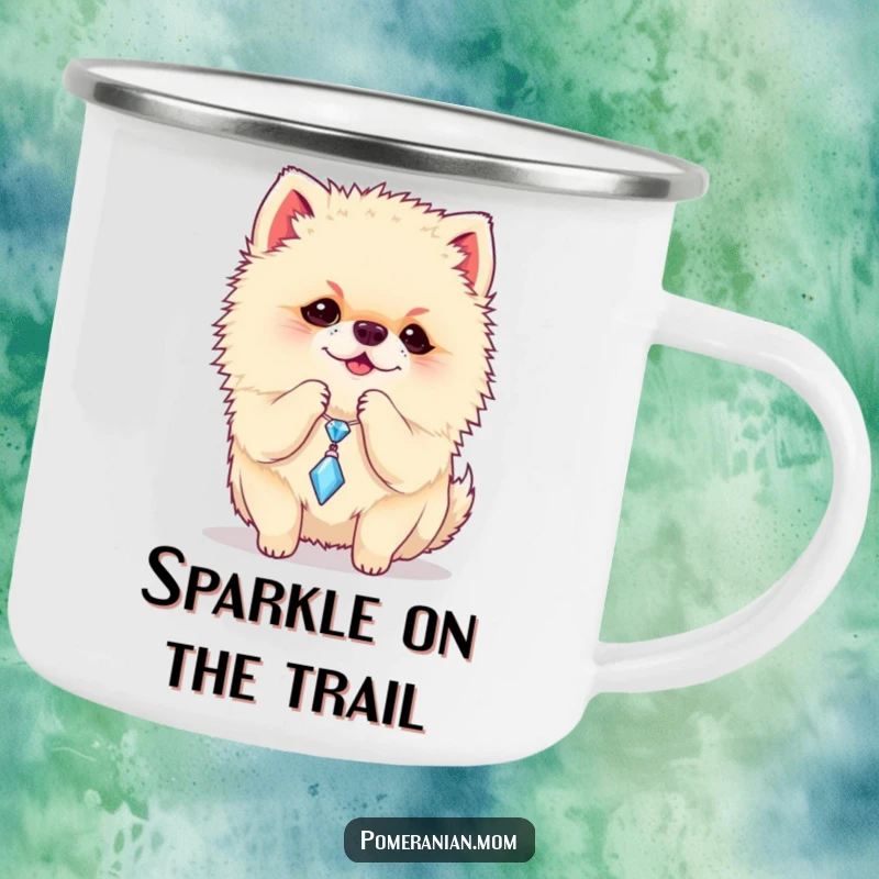 Funny Pomeranian camping mug depicting a playful dog batting at a sparkly charm, a durable and humorous cup.
