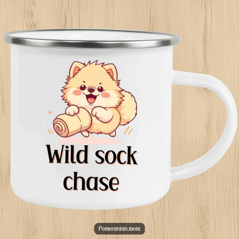 Funny camping mug featuring a kawaii Pomeranian enthusiastically chasing a rolled-up sock with its whole body, perfect for outdoor fun.