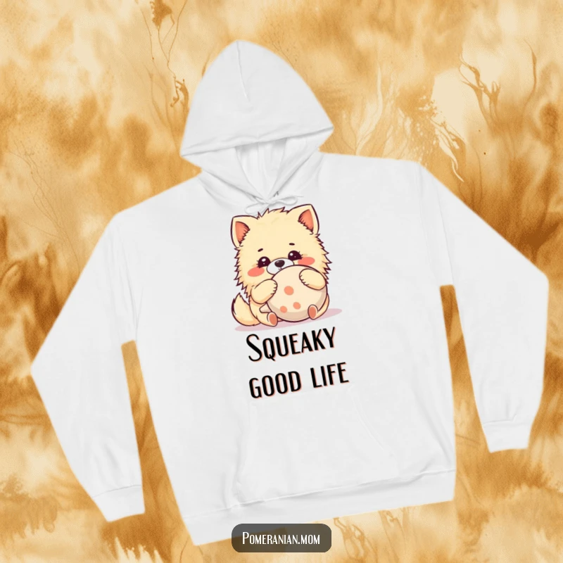 Funny Kawaii Pomeranian Hoodie: An adorable dog hugs a comically large squeaky toy with delightful glee, offering warmth and humor.