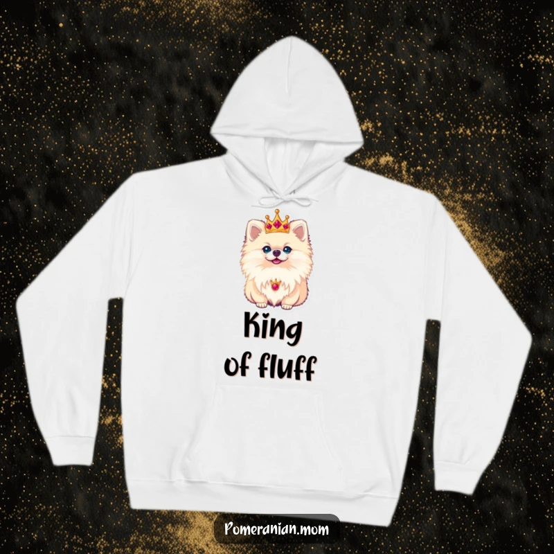 Funny Pomeranian hoodie with a tiny, elegant crown accentuating its regal posture, exuding adorable authority and canine grace.