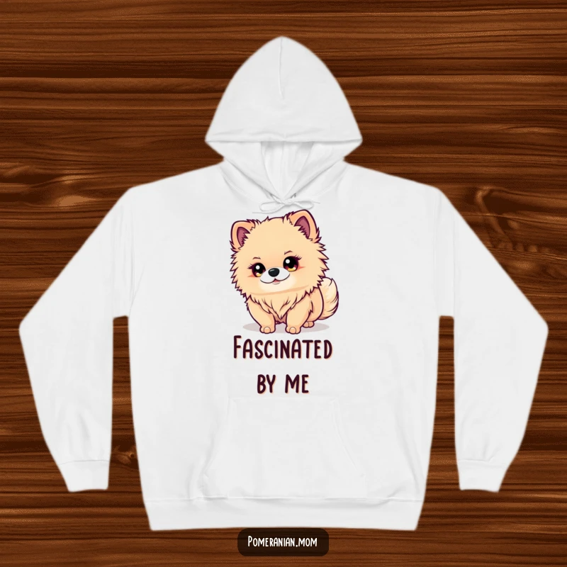 Funny Kawaii Pomeranian Hoodie: An adorable dog with sparkling eyes intently watches its wagging tail, offering warmth and humor.