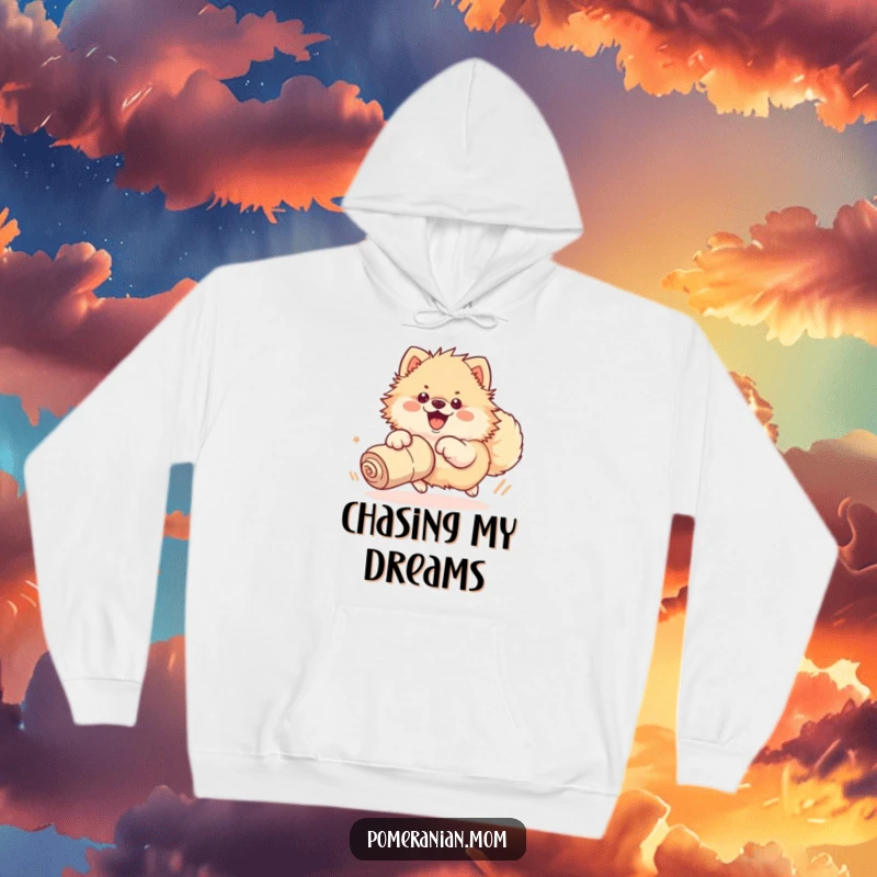 Funny hoodie depicting a kawaii Pomeranian enthusiastically chasing a rolled-up sock with its whole body, embodying pure joy.