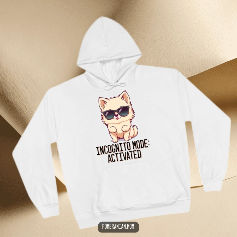 Funny tiny Pomeranian character hilariously attempting to wear oversized sunglasses on this cozy hoodie, radiating cool confidence.