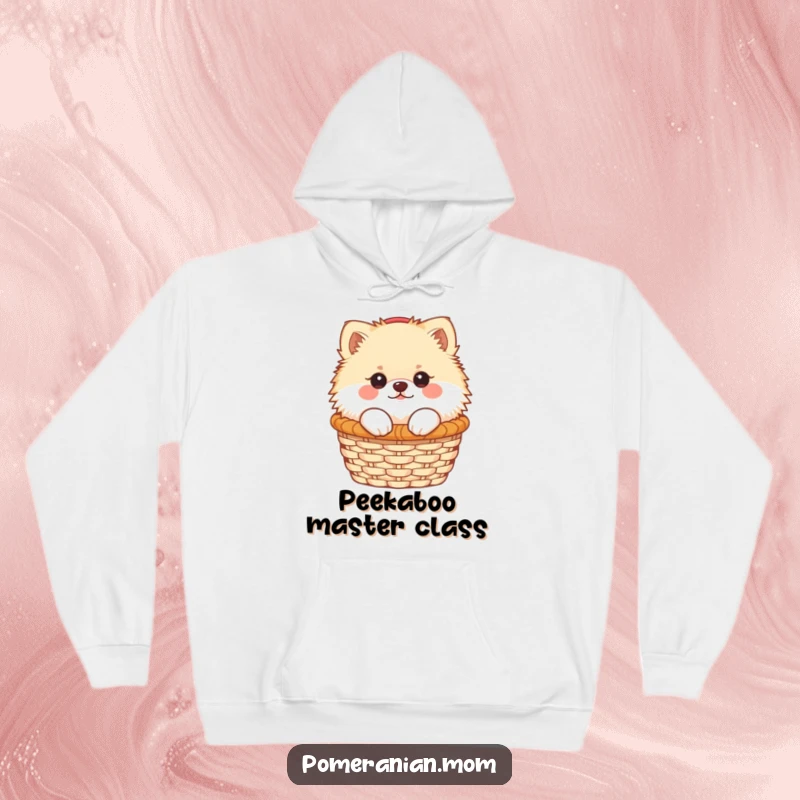 Funny Kawaii Pomeranian peeking out from a cozy basket, featured on a warm hoodie, a delightful and humorous gift idea.
