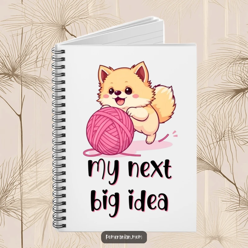 Funny Pomeranian notebook, a fluffy dog gleefully chasing a huge yarn ball, perfect for notes and sketches.